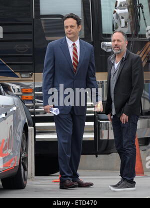 Actor Vince Vaughn wearing a blue suit while eating an apple on the set of 'Unfinished Business' filming in Los Angeles Ca.  Featuring: Vince Vaughn Where: Los Angeles, California, United States When: 20 Jan 2015 Credit: Cousart/JFXimages/WENN.com Stock Photo