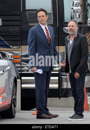 Actor Vince Vaughn wearing a blue suit while eating an apple on the set of 'Unfinished Business' filming in Los Angeles Ca.  Featuring: Vince Vaughn Where: Los Angeles, California, United States When: 20 Jan 2015 Credit: Cousart/JFXimages/WENN.com Stock Photo