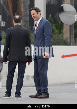 Actor Vince Vaughn wearing a blue suit while eating an apple on the set of 'Unfinished Business' filming in Los Angeles Ca.  Featuring: Vince Vaughn Where: Los Angeles, California, United States When: 20 Jan 2015 Credit: Cousart/JFXimages/WENN.com Stock Photo