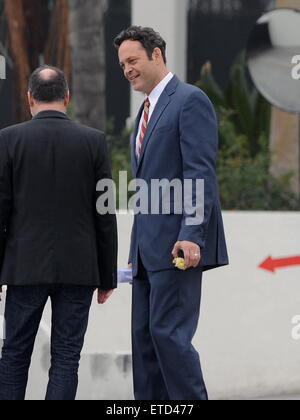 Actor Vince Vaughn wearing a blue suit while eating an apple on the set of 'Unfinished Business' filming in Los Angeles Ca.  Featuring: Vince Vaughn Where: Los Angeles, California, United States When: 20 Jan 2015 Credit: Cousart/JFXimages/WENN.com Stock Photo