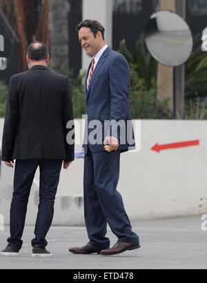 Actor Vince Vaughn wearing a blue suit while eating an apple on the set of 'Unfinished Business' filming in Los Angeles Ca.  Featuring: Vince Vaughn Where: Los Angeles, California, United States When: 20 Jan 2015 Credit: Cousart/JFXimages/WENN.com Stock Photo