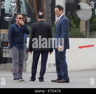 Actor Vince Vaughn wearing a blue suit while eating an apple on the set of 'Unfinished Business' filming in Los Angeles Ca.  Featuring: Vince Vaughn Where: Los Angeles, California, United States When: 20 Jan 2015 Credit: Cousart/JFXimages/WENN.com Stock Photo