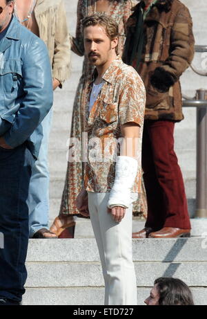 Ryan Gosling wears a cast while filming 'The Nice Guys' with co-star Russell Crowe in downtown Los Angeles  Featuring: Ryan Gosling Where: Los Angeles, California, United States When: 21 Jan 2015 Credit: Cousart/JFXimages/WENN.com Stock Photo