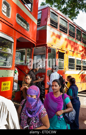 Mumbai India,Indian Asian,Fort Mumbai,Chhatrapati Shivaji Railway Station Terminus Area,BEST bus,coach,double decker,stop,riders,passenger passengers Stock Photo