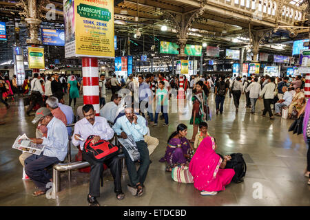 Mumbai India,Indian Asian,Fort Mumbai,Chhatrapati Shivaji Central Railways Station Terminus Area,train,public transportation,interior inside,adult adu Stock Photo