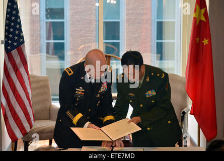 Washington, DC, USA. 12th June, 2015. Representatives from Chinese army and U.S. army sign the China-U.S. Army-to-Army Dialogue Mechanism at the National Defense University in Washington, DC, the United States, on June 12, 2015. © Wang Lei/Xinhua/Alamy Live News Stock Photo