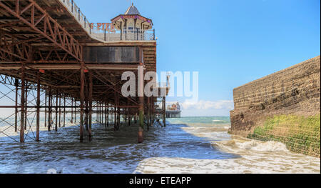 View underneath Brighton Marine Palace and Pier, or o.k.a. Palace Pier, a pleasure pier in Brighton, East Sussex, England, UK.