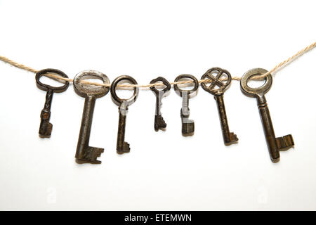 Some vintage keys from the locks on a white background Stock Photo