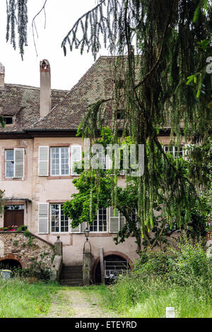 Typical alsacien house in small village, Bas-Rhin, France. Tourism and travel concept. Stock Photo