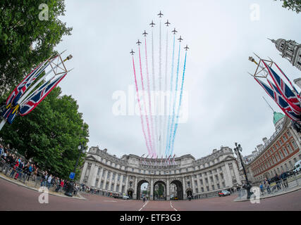 London, UK. 13th June, 2015. Flypast by the RAF Red Arrows over Admiralty Arch at 1.00pm after HRH The Queen takes the salute and inspects the parade at Trooping the Colour, The Queen’s Birthday Parade. Further aircraft due to flypast were cancelled as a result of weather conditions. Credit:  Malcolm Park editorial/Alamy Live News Stock Photo