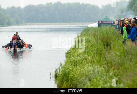 Peterborough England June 13th 2015: Wet weather does not stop play at the 17th  annual Charity Dragon Boat Festival in aid of Sue Ryder Thorpe Hall Hospice, visitors braved the rain to watch the action including one of the dragon boat's sinking. Credit: Clifford Norton/Alamy Live News Stock Photo