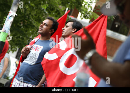 Bologna, Italy. 13th June, 2015. A demonstrators with flags looks during the protest of migrants against racism and exploitation - Freedom, not borders - on Saturday 13 Junel 2015, in Bologna. Credit:  Andrea Spinelli/Alamy Live News Stock Photo