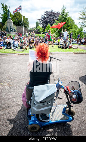Exeter, Devon, UK. 13th June, 2015. Katie Moudry adresses the audience at  the Devon 'End Austerity NOW!' Rally organised in Northernhay Gardens, Exeter on June13th, 2015 in Exeter, UK Credit:  Clive Chilvers/Alamy Live News Stock Photo
