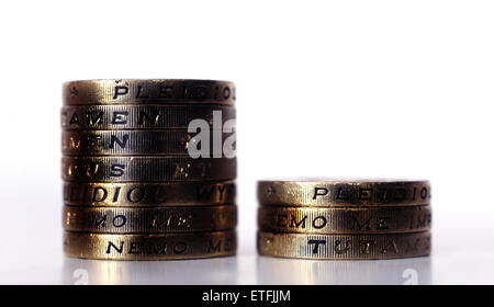 PILE OF ONE POUND COINS WITH LETTERS READING PENSION POT RE INCOMES WAGES COMPANY PENSIONS SCHEME PRIVATE SAVINGS RETIREMENT UK Stock Photo