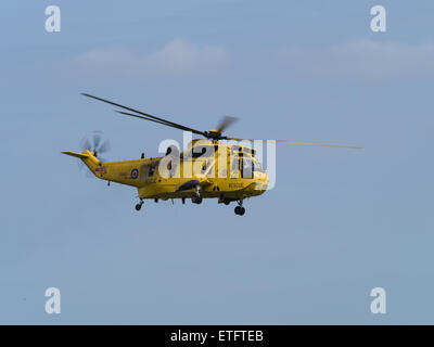 Duxford, UK - May 23rd 2015: An RAF Air Sea Rescue Sea King helicopter, flying at Duxford VE Day Airshow Stock Photo