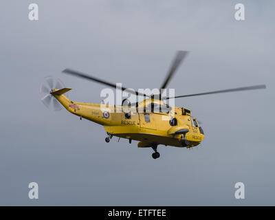 Duxford, UK - May 23rd 2015: An RAF Air Sea Rescue Sea King helicopter, flying at Duxford VE Day Airshow Stock Photo