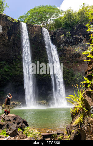 Tourist photographing Wailua Falls, Kauai, Hawaii, USA Stock Photo
