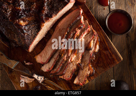 Homemade Smoked Barbecue Beef Brisket with Sauce Stock Photo