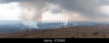 Wide view of the active Kilauea Caldera with steam rising from the ...