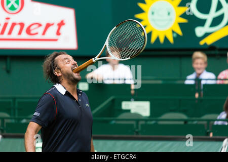 Halle Westfalen, Germany. 13th Jun, 2015.  Henri Leconte jokes around during his  Champions' Trophy match at the start of the Gerry Weber Open. Stock Photo