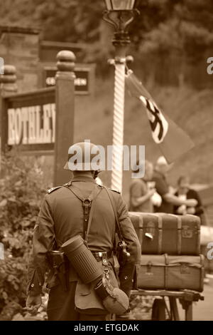 German soldier parading the platform during the Great Central Railways 1940s weekend, in Leicestershire. Have edited it to be in Stock Photo