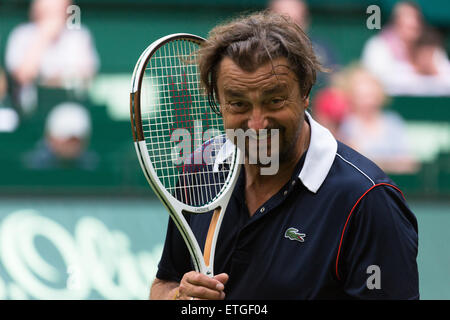 Halle Westfalen, Germany. 13th Jun, 2015.  Henri Leconte enjoys a joke during his Champions' Trophy match at the Gerry Weber Stadium at the start of the Gerry Weber Open. Stock Photo