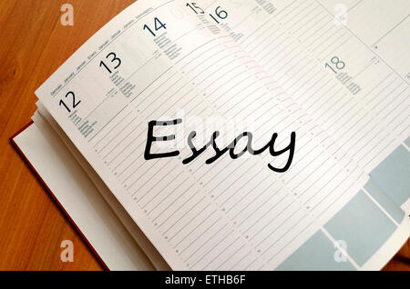 Business Notepad on wooden table Essay concept Stock Photo