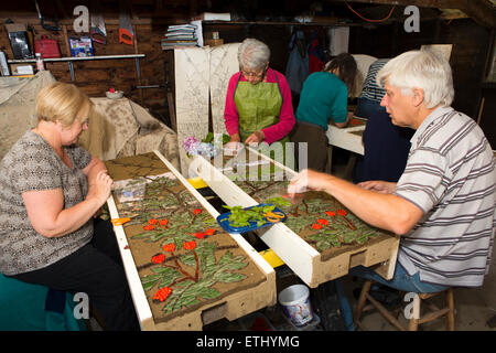 UK, England, Derbyshire, Eyam, volunteers constructing the Requisitioning of Horses 2014 well dressing Stock Photo