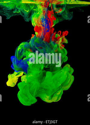 Studio shot of colored ink in water on black background Stock Photo