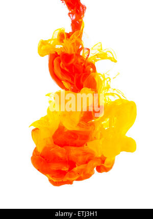 Studio shot of colored ink in water, isolated on white background Stock Photo
