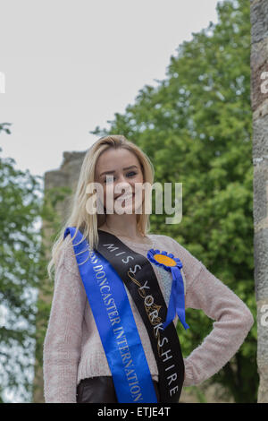 Knaresborough. North Yorkshire. UK. 13th June 2015. 'Miss Yorkshire' in the grounds of Knaresborough Castle before the start of the 50th annual bed race. Credit:  RHB/Alamy Live News Stock Photo
