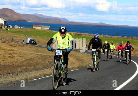 Reykjavik, Iceland. 13th June, 2015. Riders take part in the 20th annual Blue Lagoon Challenge, a 60km mountain bike race from Hafnarfjordur to the Blue Lagoon, in south suburb of Reykjavik, Iceland, June 13, 2015. © Huang Xiaonan/Xinhua/Alamy Live News Stock Photo