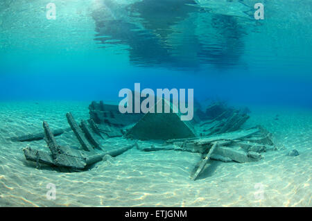 old wrecked wooden fishing boat on the sandy bottom, Red sea, Marsa Alam, Egypt Stock Photo