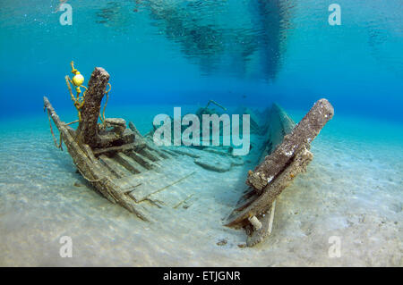 old wrecked wooden fishing boat on the sandy bottom, Red sea, Marsa Alam, Egypt Stock Photo