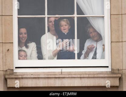 Britian's Prince George is held by a nanny as he waves through a window of Buckingham Palace 13 June 2015 while the Royal Family head for Horse Guards Parade nearby for the annual Trooping the Colour ceremony to mark the monarch's official birthday. Photo: Patrick van Katwijk/ POINT DE VUE OUT - NO WIRE SERVICE - Stock Photo