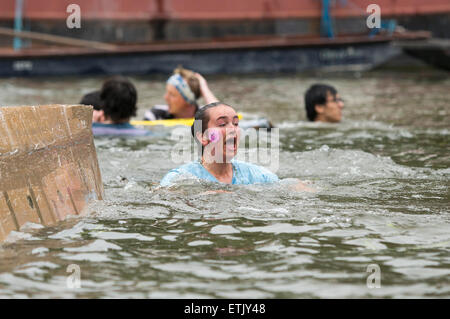 Cambridge, UK. 14th June, 2015. Cambridge University Students Cardboard Boat Race. A good day for a dip. Credit:  Action Plus Sports/Alamy Live News Stock Photo