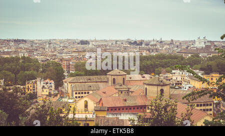 Personal perspective of Rome, Italy, at dusk. Panoramic cityscape from above with old retro filter applied. Toned image. Stock Photo