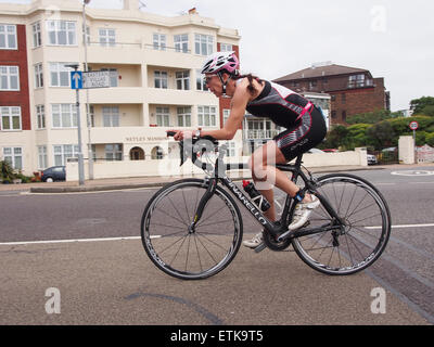 Portsmouth, UK. 14th June, 2015. A competitor undertakes the cycling section of  the Portsmouth Try a Tri triathlon event. The event consisted of a number of sprint triathlons of different lengths to accomodate differing abilities. Credit:  simon evans/Alamy Live News Stock Photo