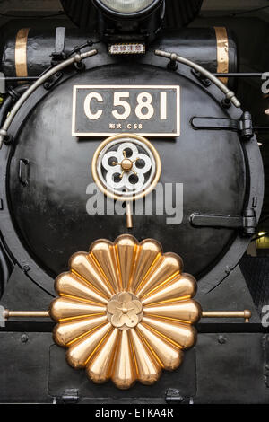 Japan, Kyoto. TheUmekoji Steam Locomotive Museum. The train engine Model C581 1938 (Showa 13) Locomotive with Imperial emblem on the front Stock Photo