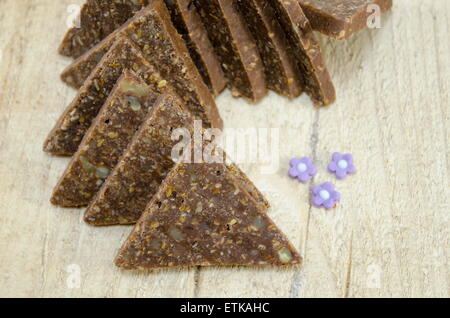 Homemade triangle shaped chocolate and walnut sweets Stock Photo