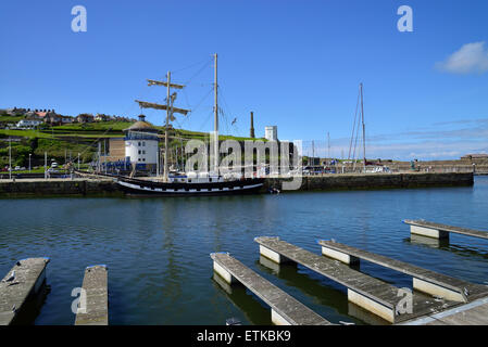 la malouine french sailing ship moored at whitehaven marina west cumbria on a bright sunny day with the beacon behind Stock Photo