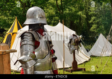 DEURNE, BELGIUM-JUNE 13, 2015: Exposed for sales on medieval market reconstructions of casques of knights Stock Photo