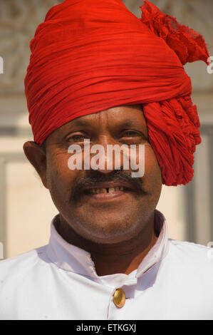 Rajasthani man in red turban. Palace of Jaipur, Jaipur, Rajasthan, India Stock Photo