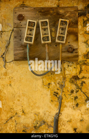 Indian electricity junction boxes on a wall. Jaipur, Rajasthan, India Stock Photo