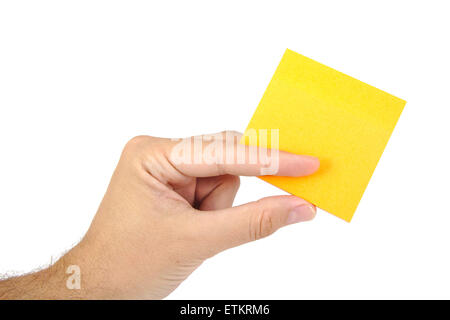 Man hand holding a tellow sticky note isolated on white background Stock Photo
