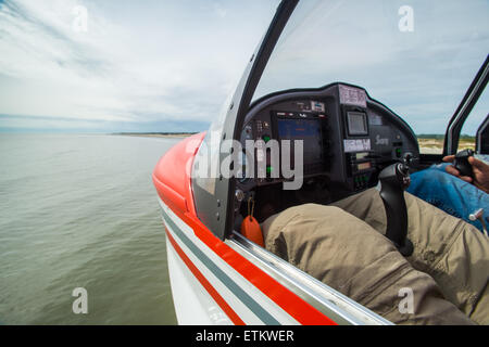 Instrument panel of seaplane while flying over water in Southeastern USA Stock Photo