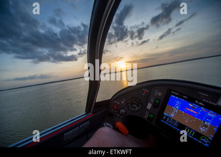 Instrument of seaplane while flying above water at sunset in Southeastern USA Stock Photo