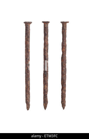 Three Old Rusty Nails on White Background Stock Photo