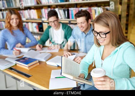 students reading and drinking coffee in library Stock Photo
