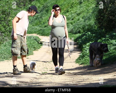 Heavily pregnant Milla Jovovich and her husband Paul go for a walk with their pet dogs in Beverly Hills  Featuring: Milla Jovovich, Paul W.S. Anderson Where: Beverly Hills, California, United States When: 13 Mar 2015 Credit: WENN.com Stock Photo